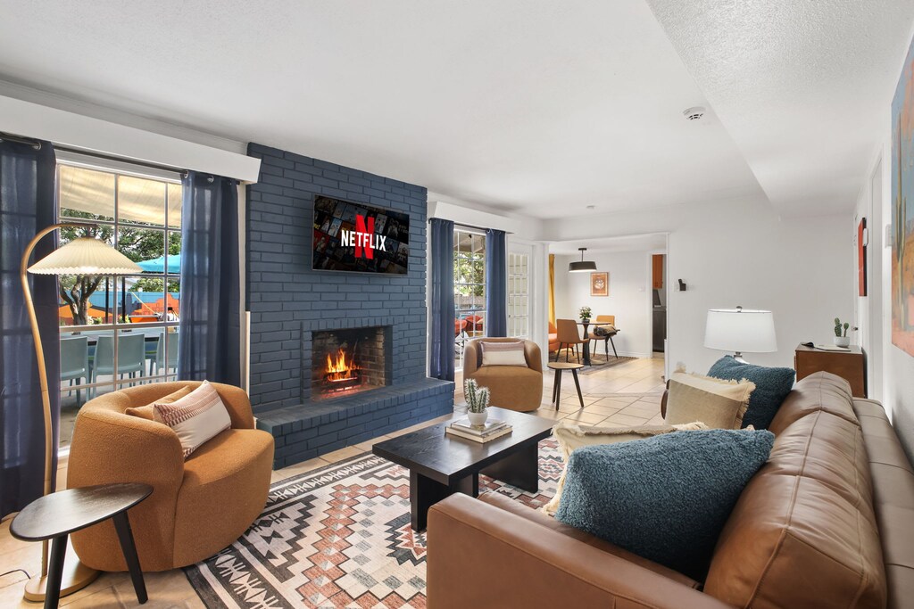 Netflix & chill just got an upgrade! Cozy up by the fireplace, sink into these plush sofas, and let the good times roll. Popcorn, anyone?