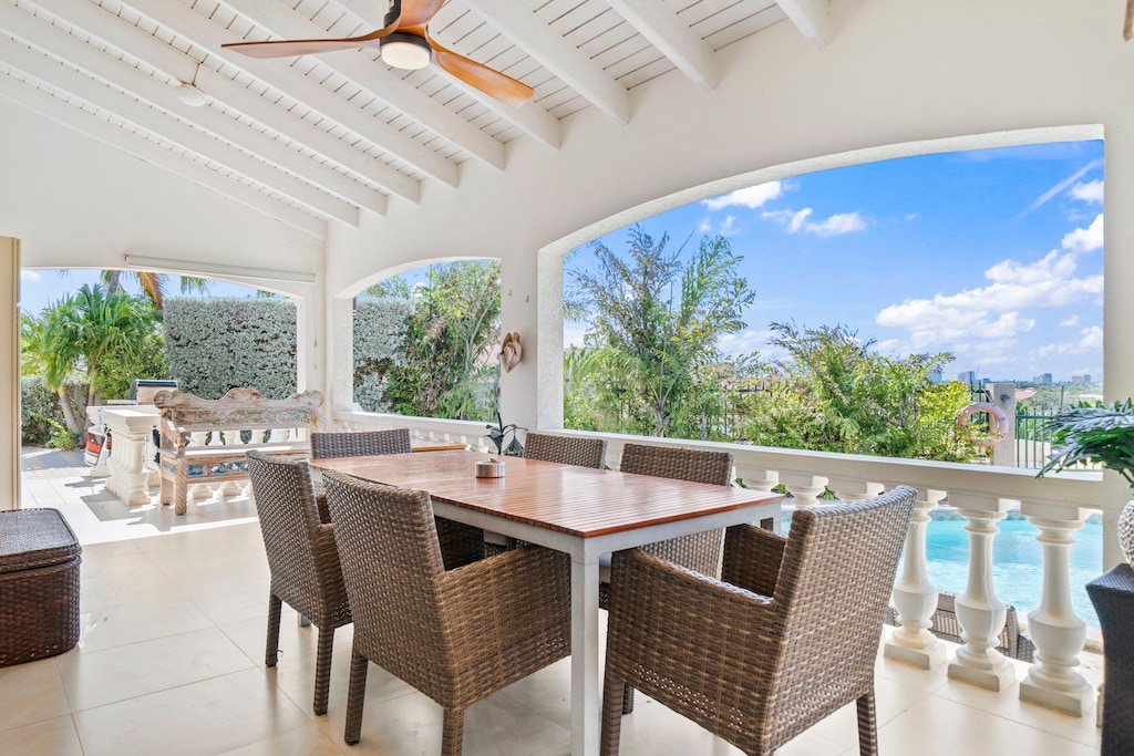 Large outdoor dining table with a pool view