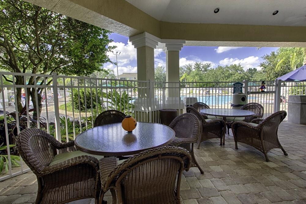Relax at the covered outdoor seating area with scenic views.