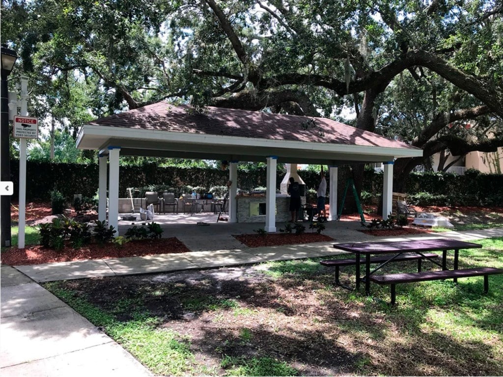Outdoor pavilion with picnic tables, perfect for family gatherings and barbecues.
