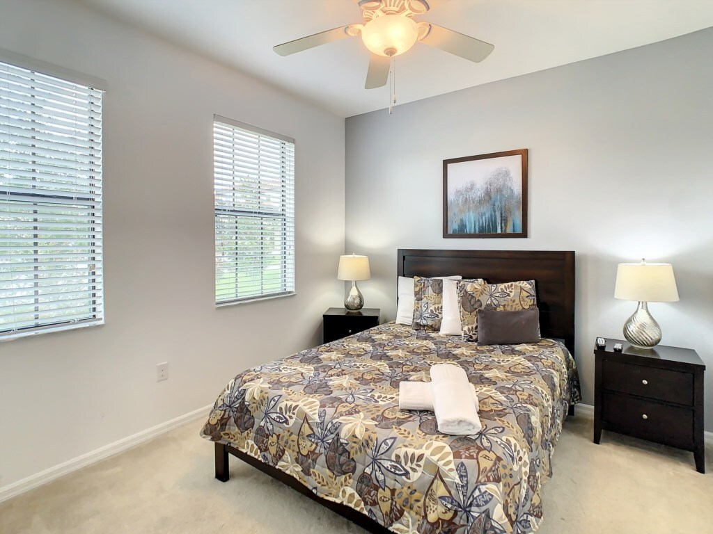 Guest bedroom with natural light and a tranquil ambiance for restful nights.