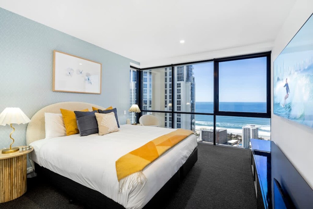 Master bedroom with king bed, large TV and ocean views.