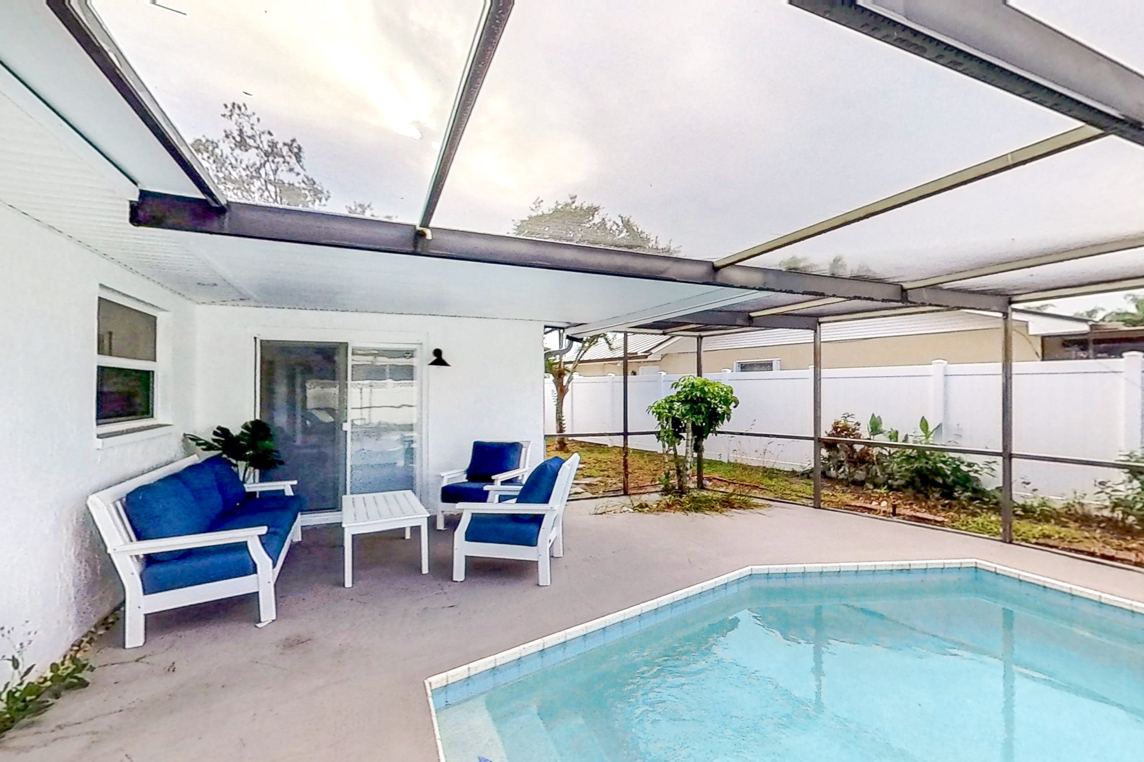 Bright & open home with private pool, screened lanai, enclosed yard, & W/D Bright & open home with private pool, screened lanai, enclosed yard, & W/D