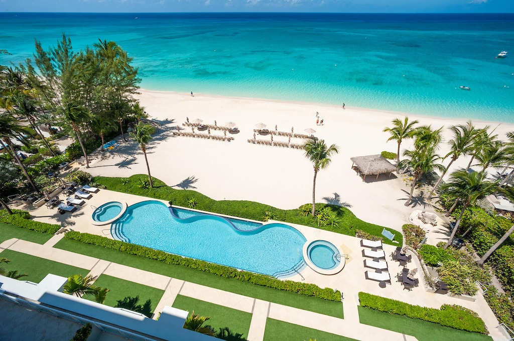 Views of the resort's pool, heated spas, and dreamy beachfront.