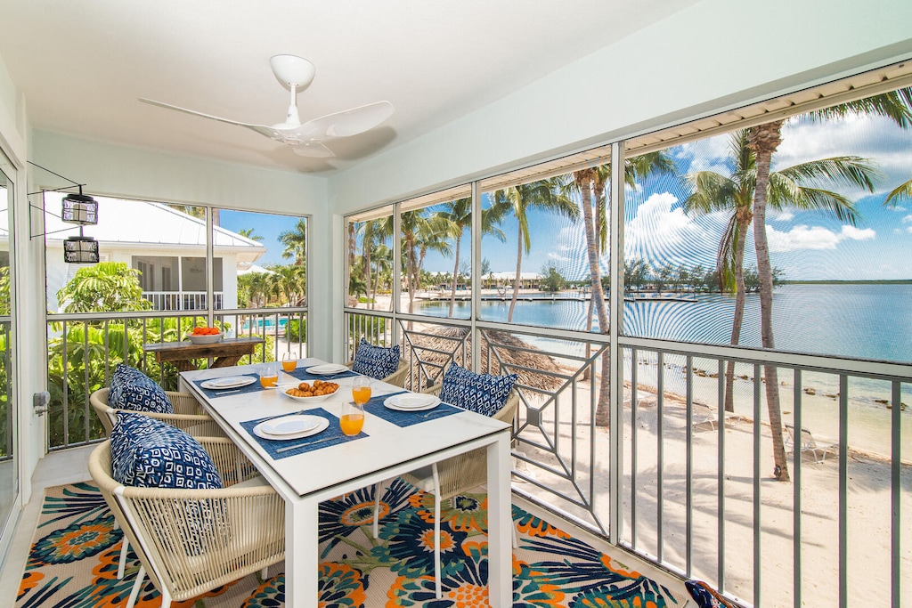 Beachfront dining on the screened balcony.