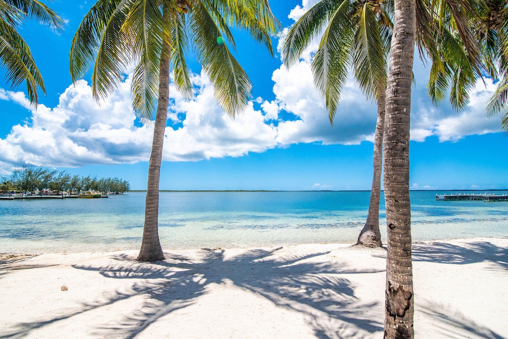White sandy beach steps off your front door.