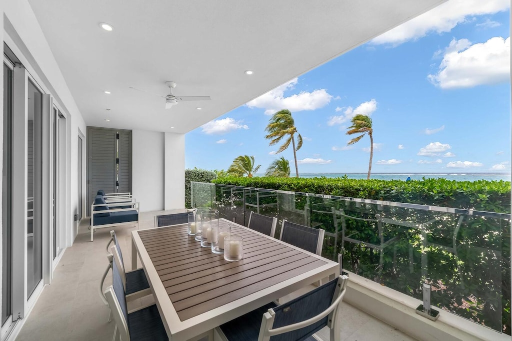 Furnished veranda with walkout access to the beach.