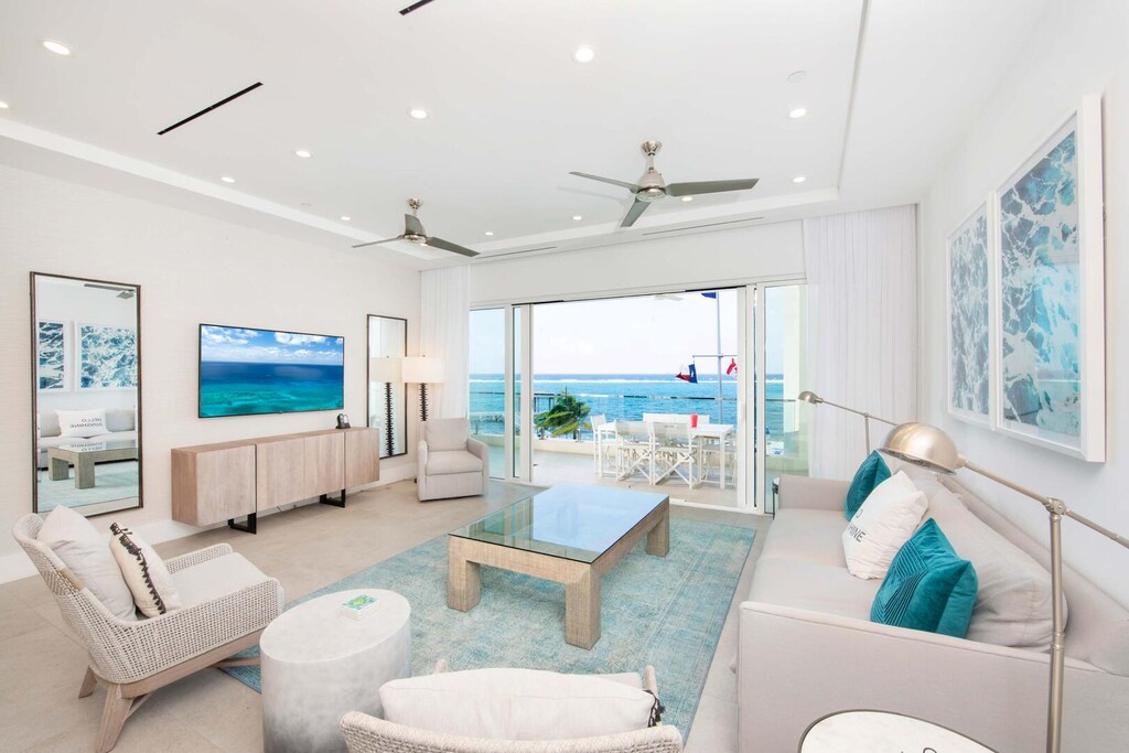 Spacious living area with coastal decor and stunning ocean views.