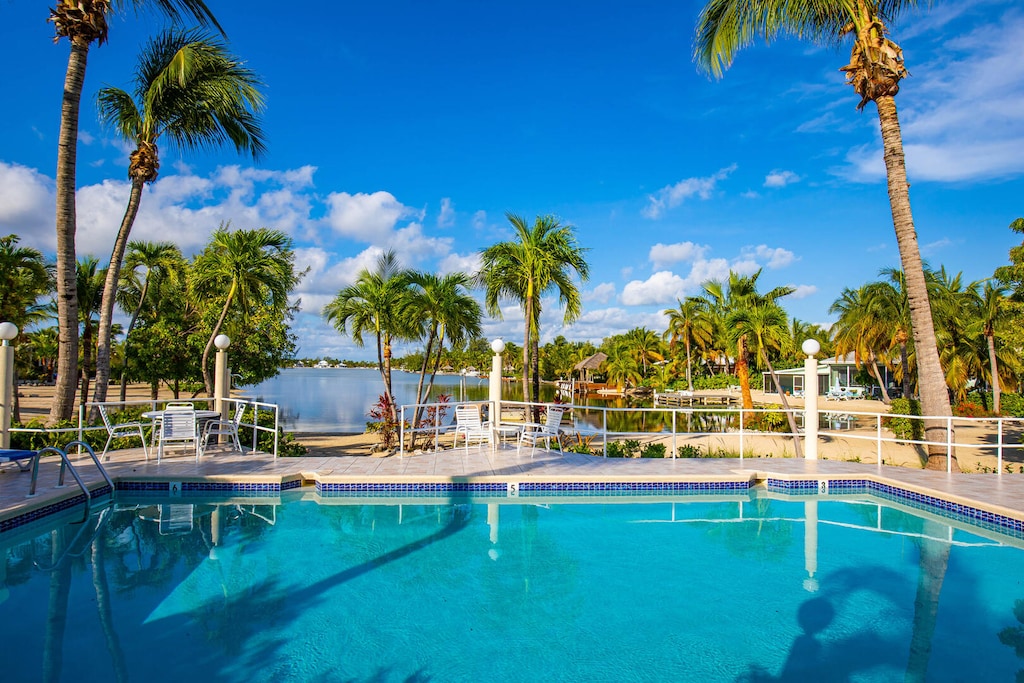 Communal pool overlooks Cayman Kai cove.