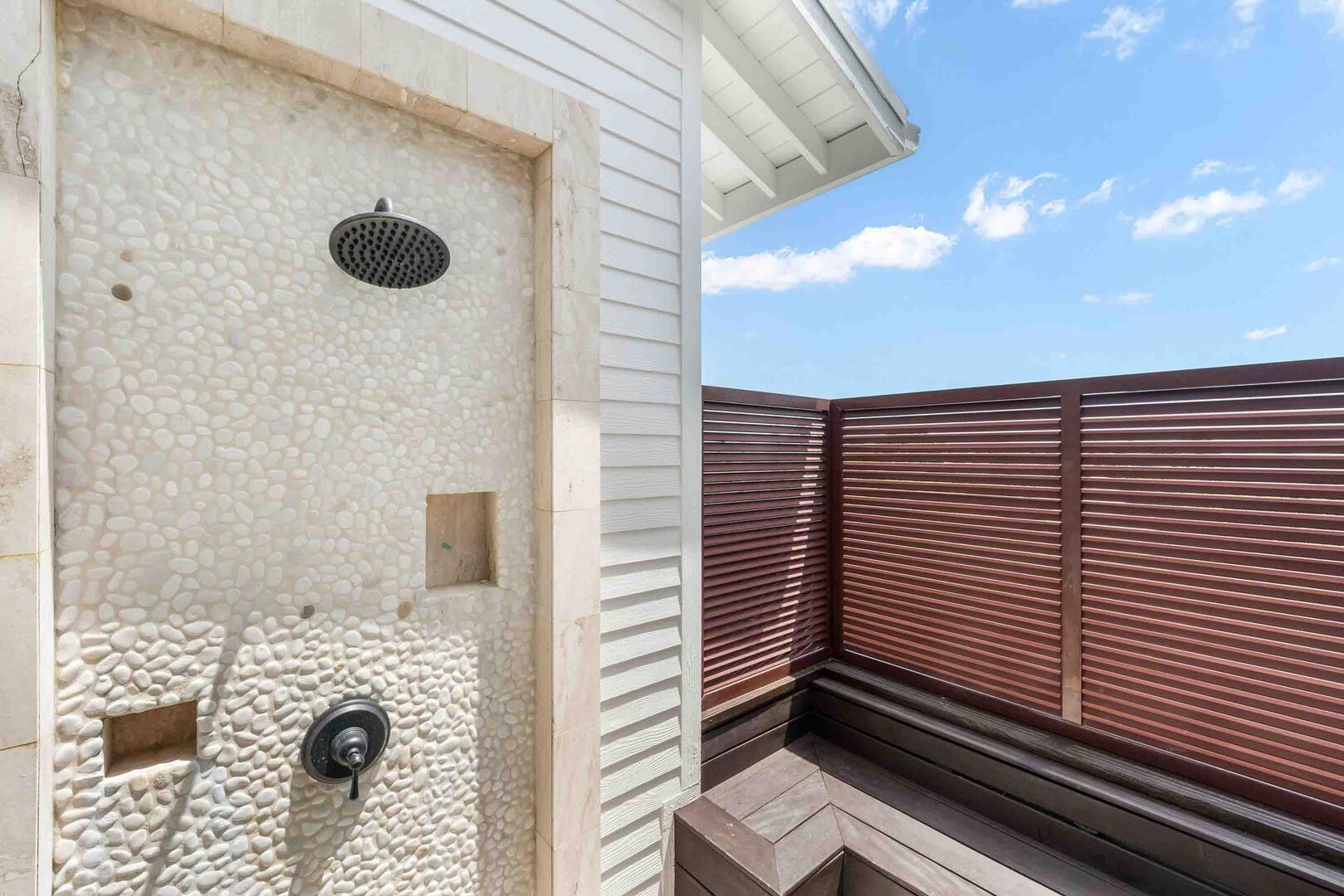 Bedroom 1 ensuite also includes walkout access to a private alfresco shower with privacy screening.