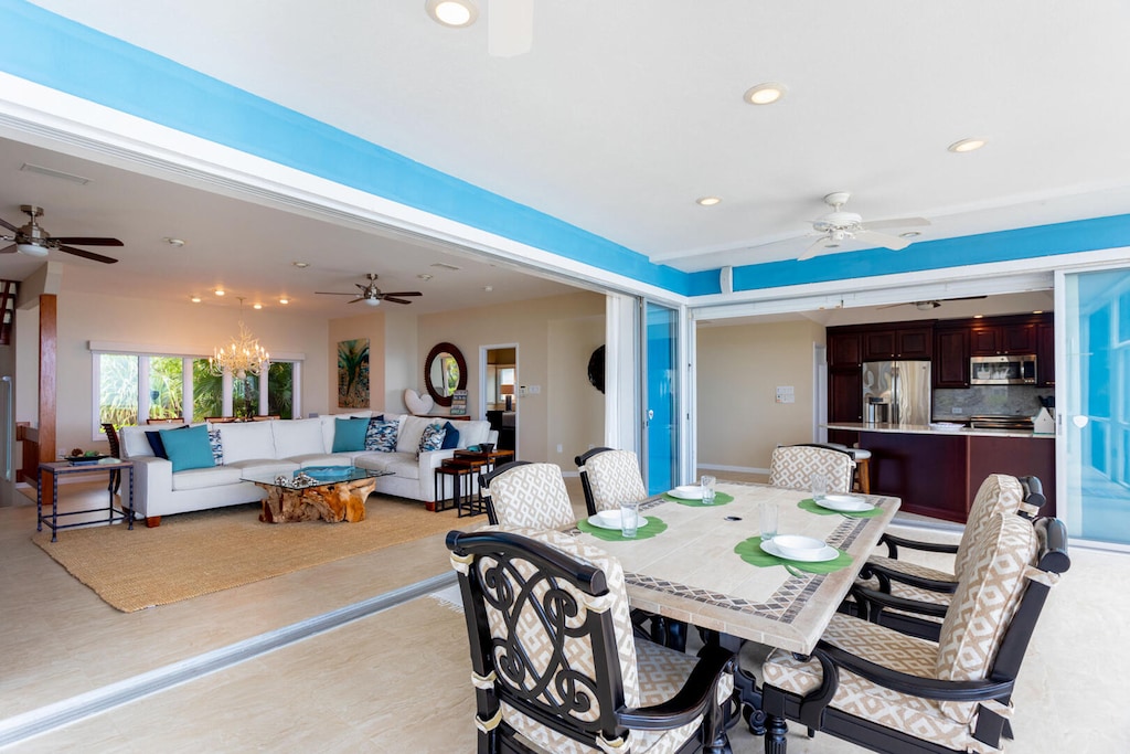Great room and kitchen both open out to the screened porch.