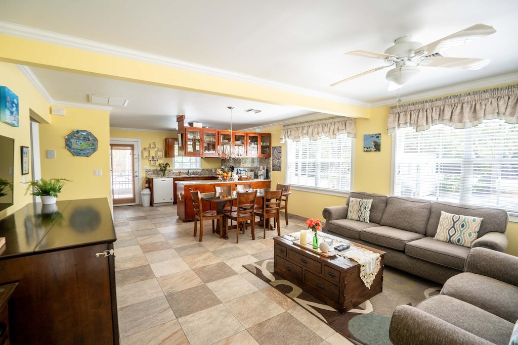 Open design family room encompassing the living, dining, and kitchen areas.