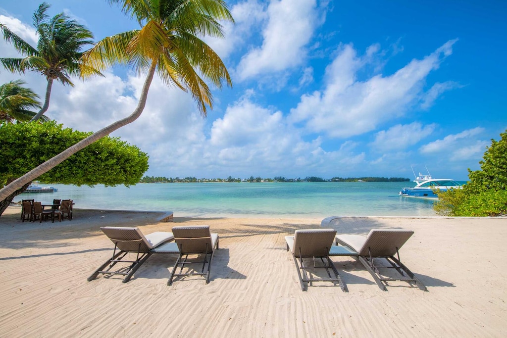 Sun loungers on beach.