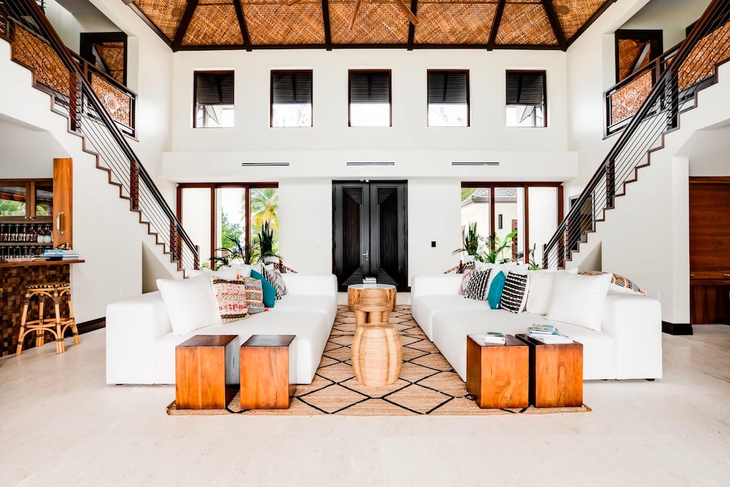 The great room has an open-concept design with a two-story vaulted ceiling.