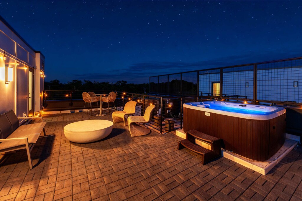 Experience Nashville in this stylish downtown retreat with a rooftop deck, private hot tub, and skyline views. Perfect for large groups or bachelorette parties, this chic oasis promises a memorable stay in Music City!