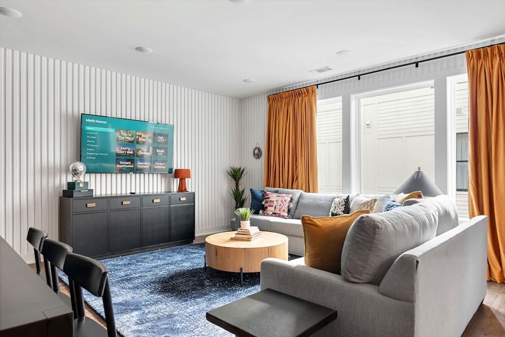Welcome to your Nashville oasis, where style meets comfort. This elegant living space features cozy seating and vibrant accents, perfect for game nights or relaxing with friends. Enjoy city views just steps from downtown!