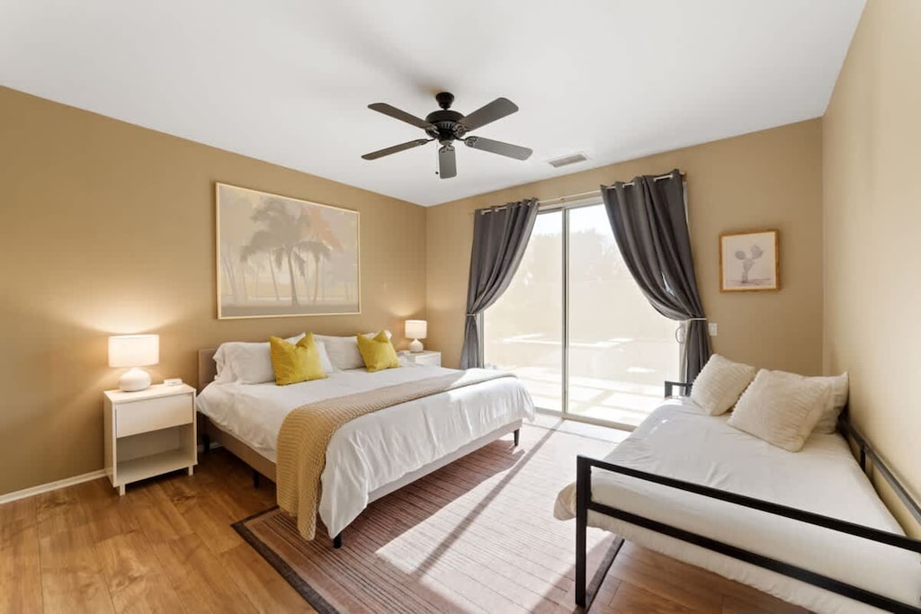 Bright Master bedroom with cozy double bed