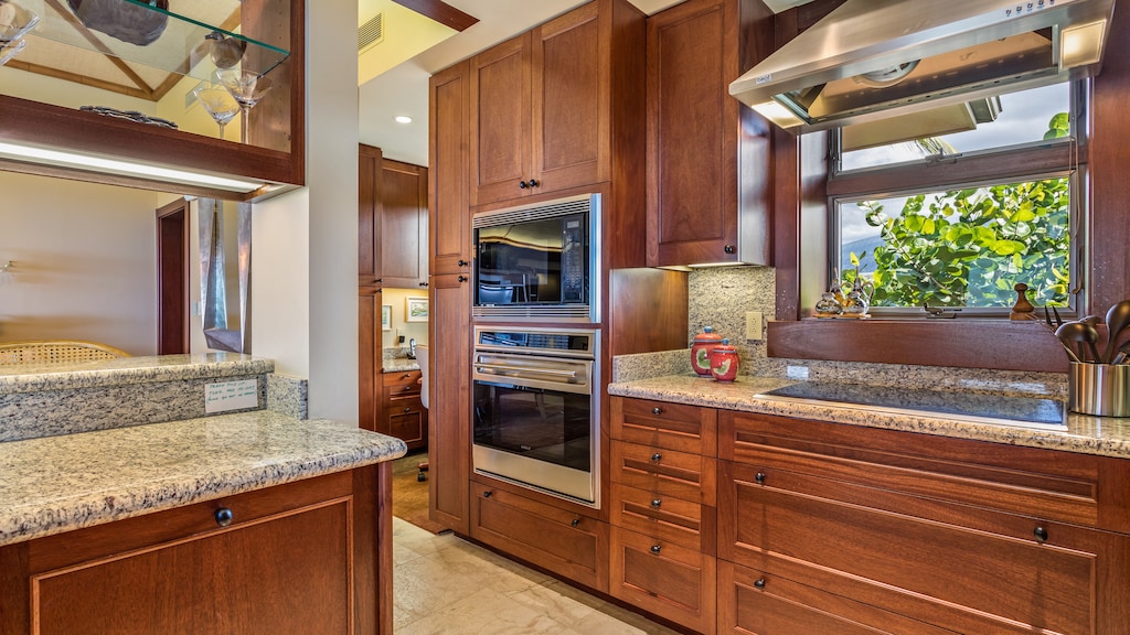 Stainless Steel Appliances & Gleaming Granite Countertops.