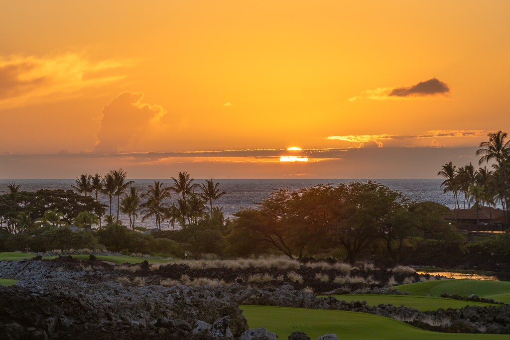 Sunset over Hualalai’s coastline and fairways—every evening ends in brilliance.
