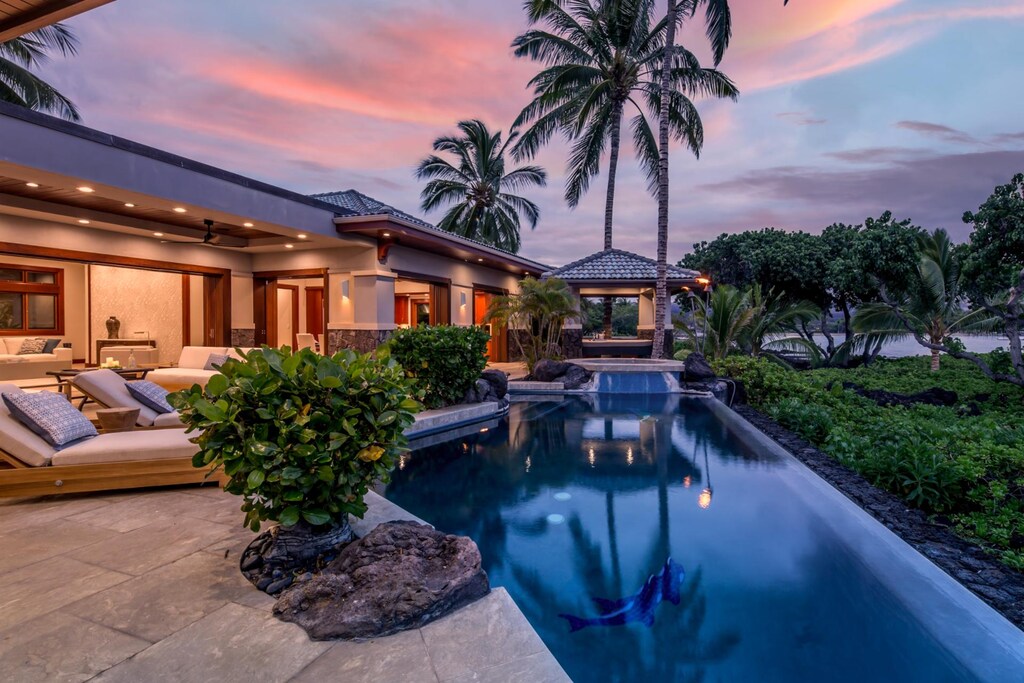 Unwind beside the private oceanfront infinity pool, surrounded by lush tropical gardens and swaying palms, your personal slice of Hawaiian paradise.