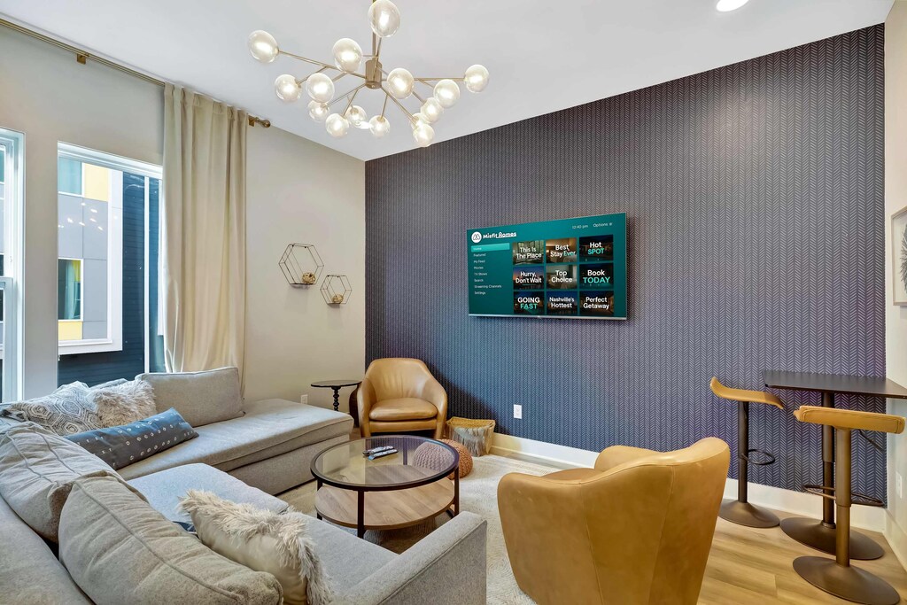 Experience modern elegance in this stylish Nashville vacation rental. Unwind in the plush living area, perfect for large groups and unforgettable memories. Host game nights or enjoy quiet evenings in this upscale oasis!