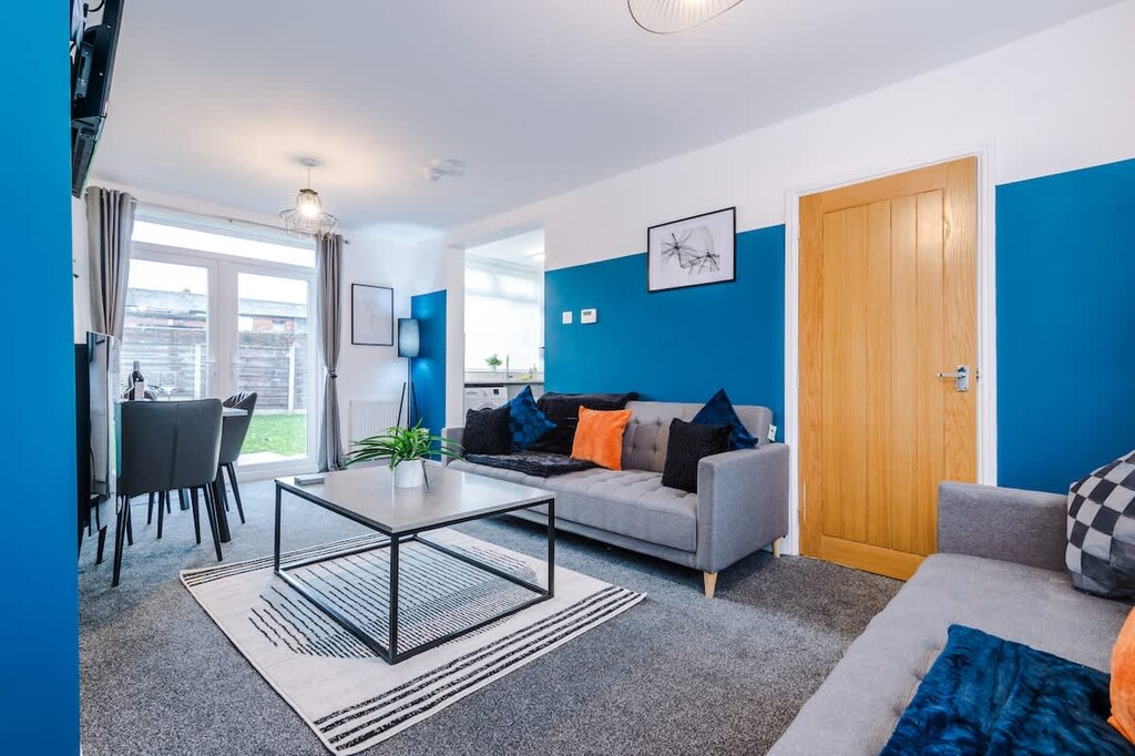 The spacious open-plan living space benefits from 2 sofa beds, a 40-inch smart TV and plenty of space to sit down and relax.