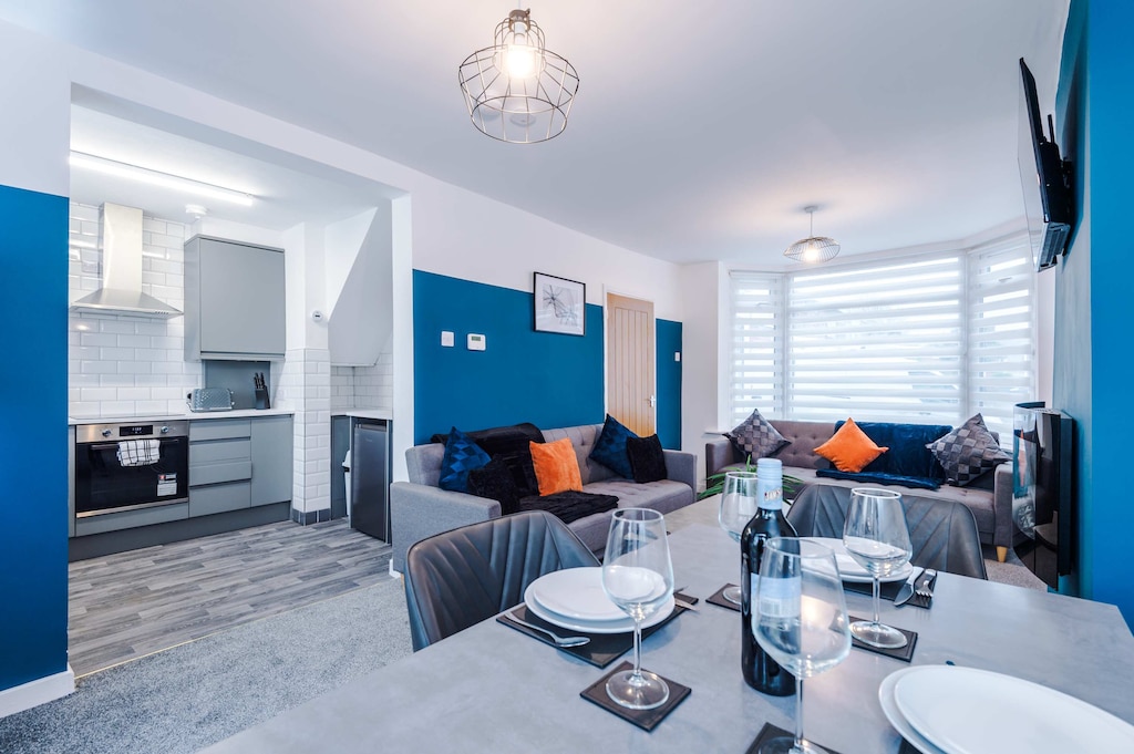 The spacious open-plan living space benefits from 2 sofa beds, a 40-inch smart TV and plenty of space to sit down and relax.