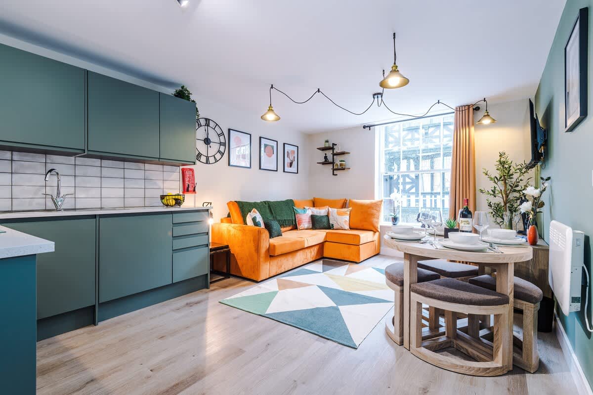 The spacious open-plan living space benefits from a double sofa bed, smart TV, dining area for 4 and a fully equipped kitchen.