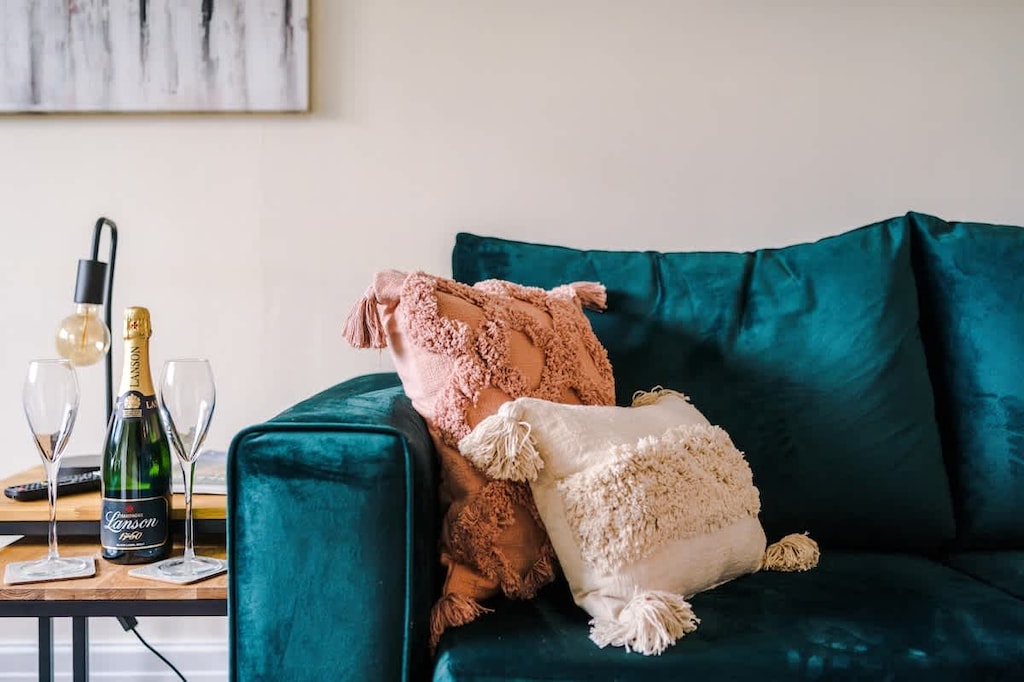 The living room boasts two comfortable sofas, one of which can be used as a sofa bed should you need it.