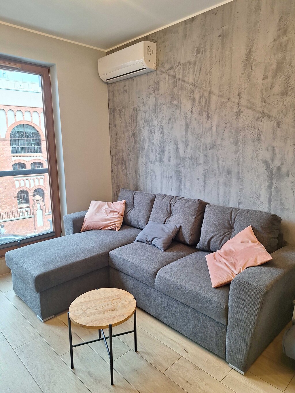 Living room with a comfortable sofa and TV. 