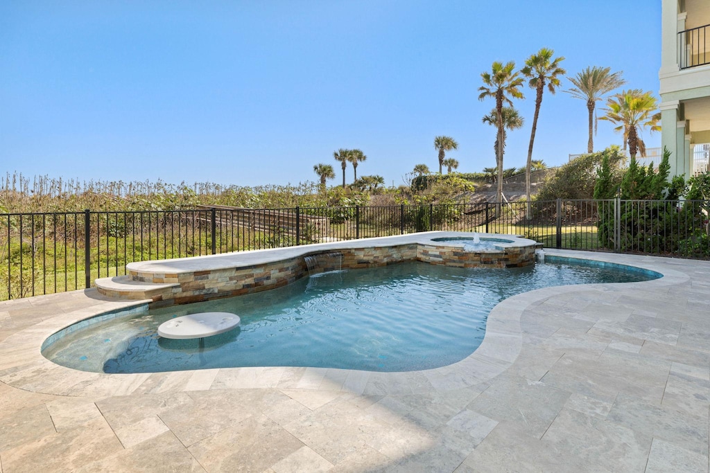Incredible pool with Swim-up table, bench, waterfall feature and spa.
