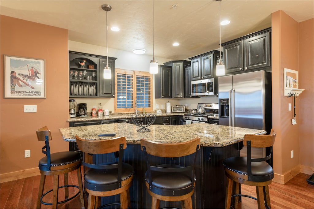 Kitchen connects to dining area, creating practical meal space.