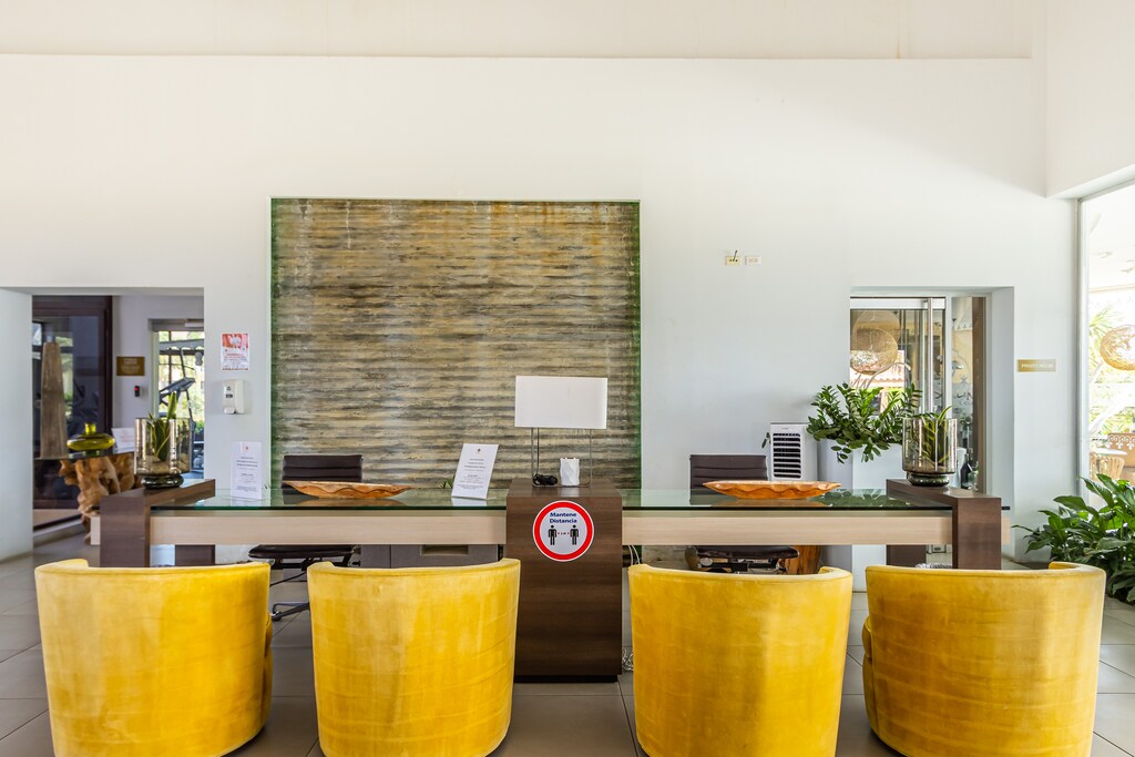 - Our resort's reception in the lobby provides a friendly and professional greeting upon your arrival. - Experience seamless check-in at our stylishly designed lobby reception. - Enjoy a welcoming atmosphere at our resort's lobby reception