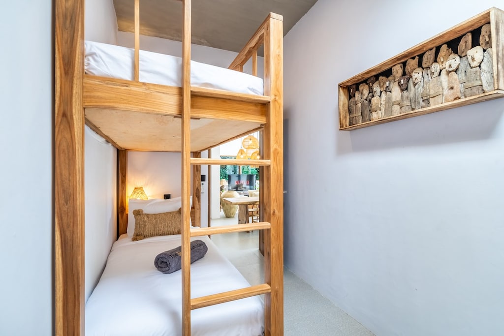 A cozy and stylish bunk bed room perfect for kids or friends, featuring comfortable bedding, ample storage, and a fun, space-saving layout ideal for group stays in the villa. #Villa Samalas