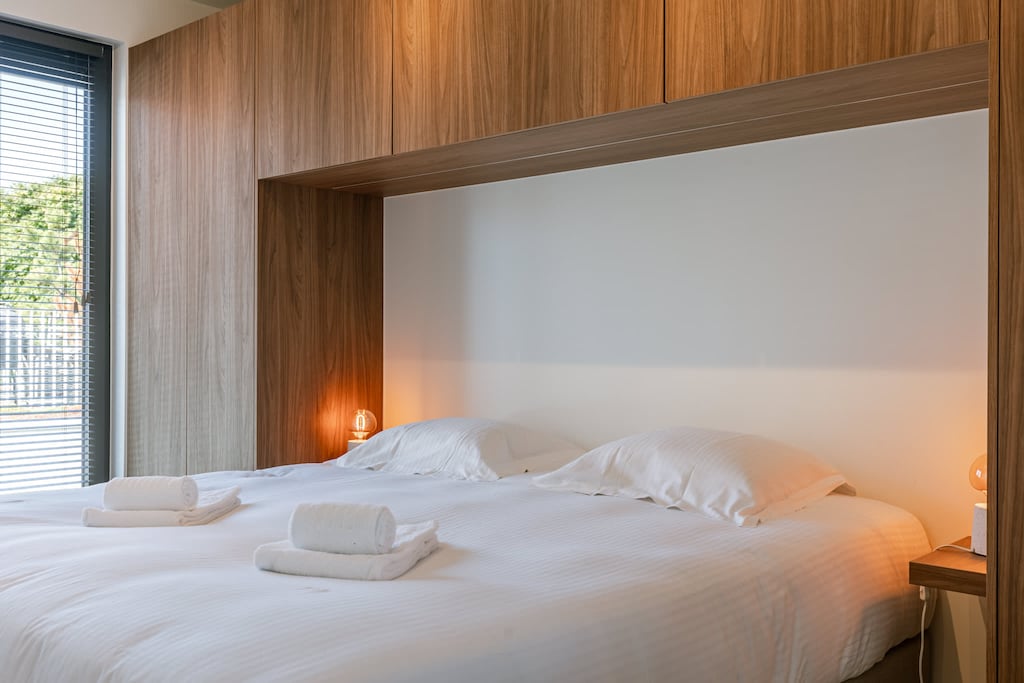 Bedroom with wooden accents and soft lighting for restful nights