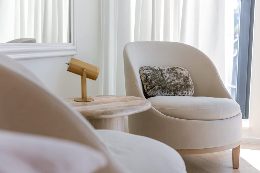 Comfortable armchair with cushions, perfect for quiet relaxation