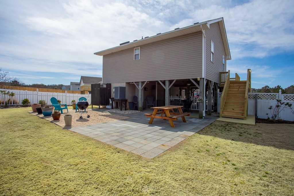 Make your way out back to the large, fenced backyard where your four-legged canine family members can play freely!
