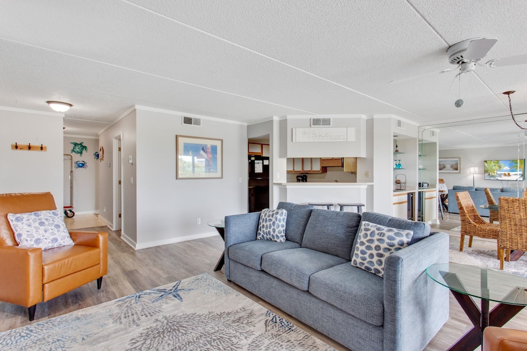 Relax on plenty of cozy furniture in the Living Area as you enjoy the wall of windows along the oceanfront side of this cozy condo.