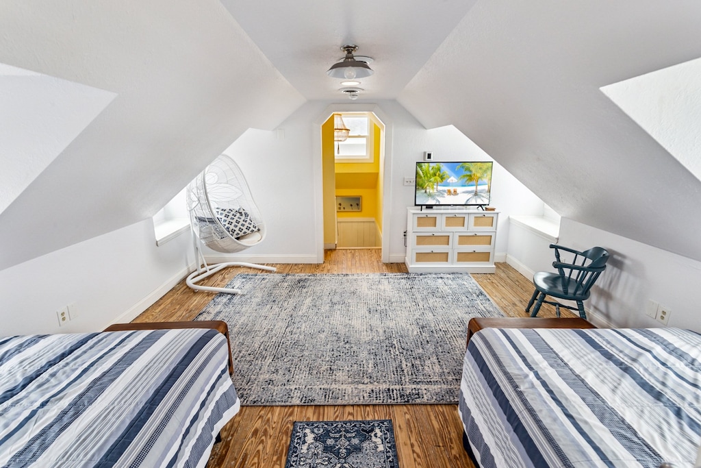 The Top-Level Bedroom with 2 Double Beds and a Full Bathroom is the perfect spot to settle in after a day in the sand.