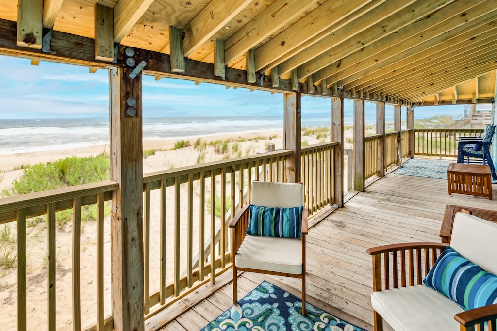 Relax on the back deck overlooking the beach!