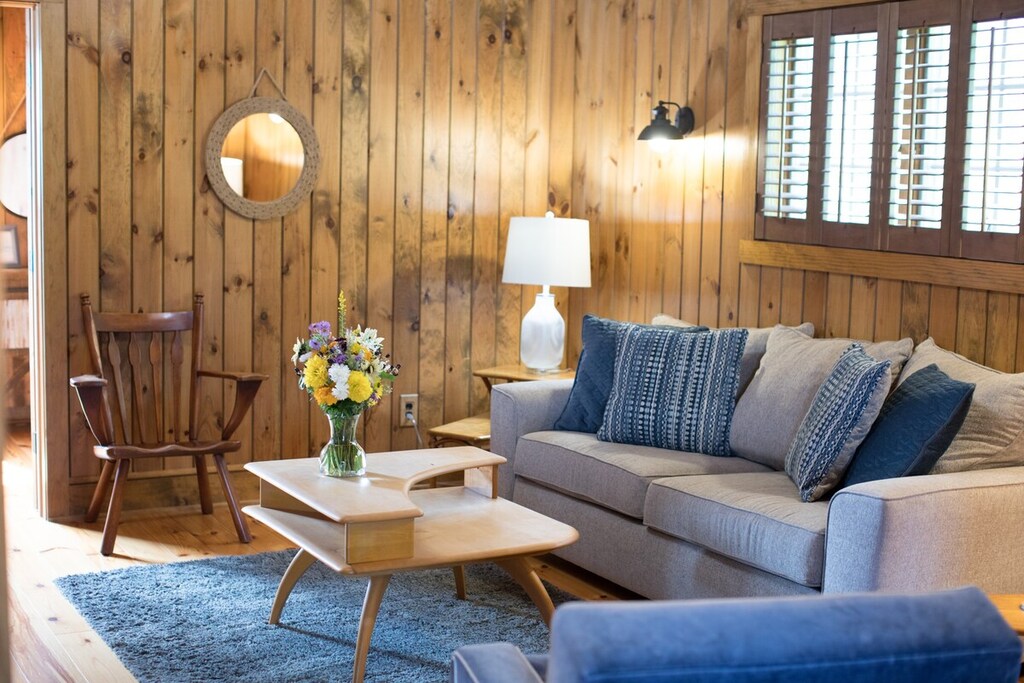 Second Floor Living Room- wood-paneled charm with plush seating—perfect for game nights.