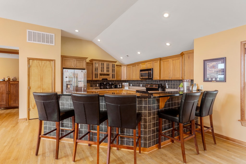 The kitchen will be an inspiration for any family chef thanks to stainless steel appliances and a posh adjacent breakfast bar.