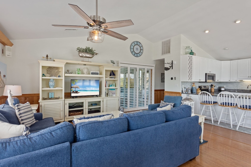 Relax in the spacious Living Area with a TV and lots of comfortable seating options.