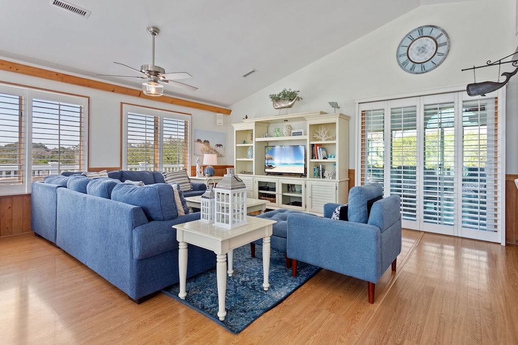 Relax in the spacious Living Area with a TV and lots of comfortable seating options.