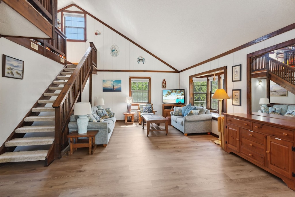 Relax in the spacious Living Area with a large, Flat Screen TV and lots of cozy furniture.