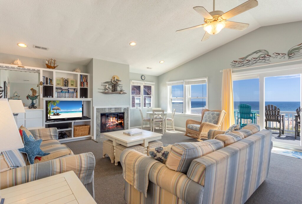 Living area with ocean views and fireplace