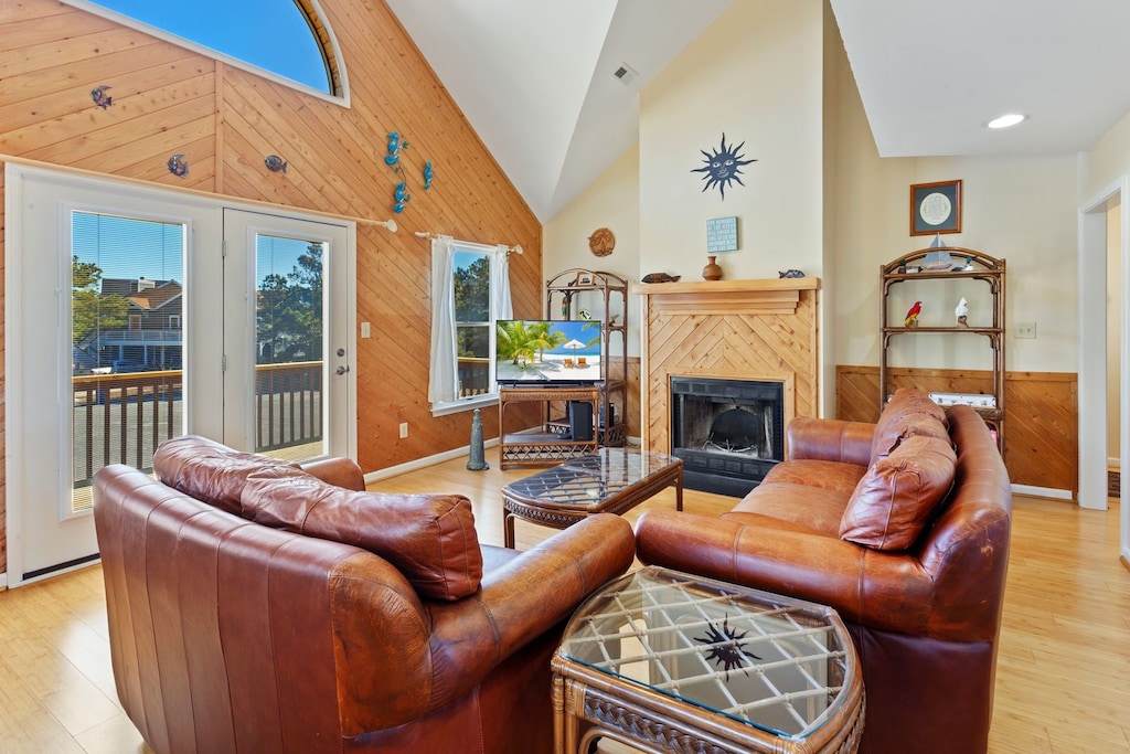 The Mid-Level Living Area boasts high ceilings and lots of natural light for the perfect Outer Banks vacation! (Please note: Fireplace is not for guest use.)