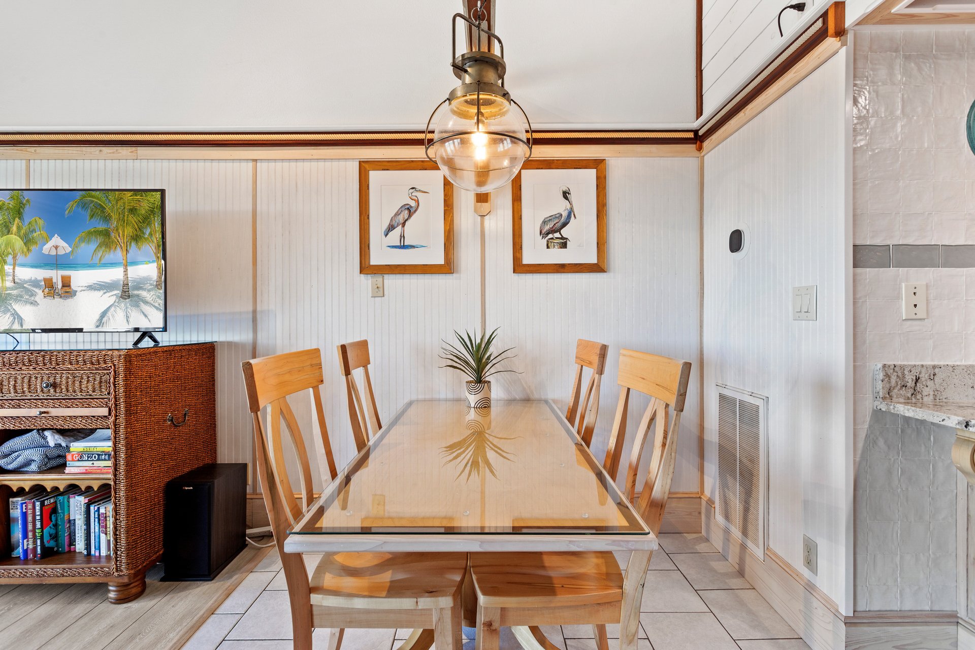 Whip up something delicious in the quaint Kitchen to enjoy together in the adjacent Dining Area or at the Counter Bar, all surrounded by beautifully tasteful coastal decor and brilliant nautical accents.