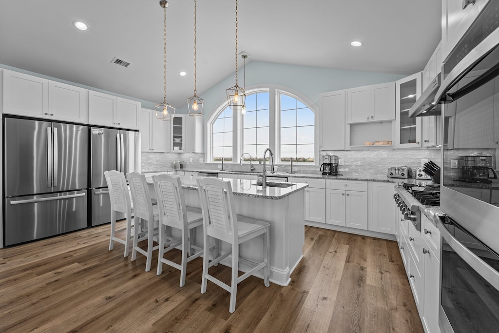 The chef's Kitchen boasts stainless steel appliances and two refrigerators to keep everyone well-fed and refreshed.