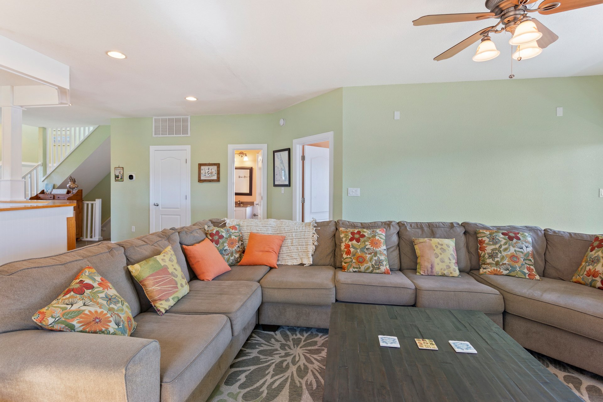 Start your vacation in quiet seaside luxury with a spacious Living Area that boasts a large, Flat Screen TV and plenty of cozy furniture.